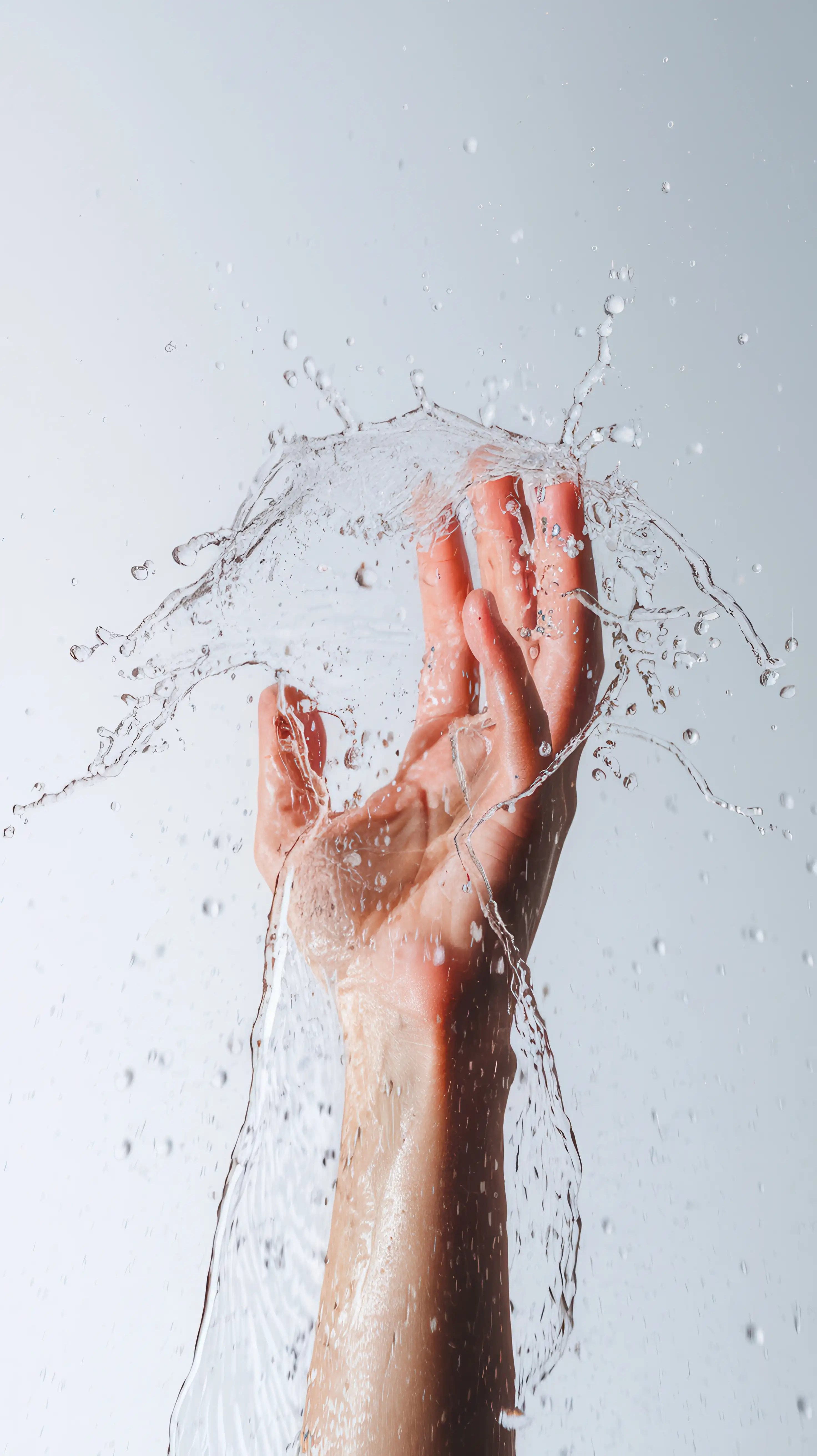 Hand touching purified water
