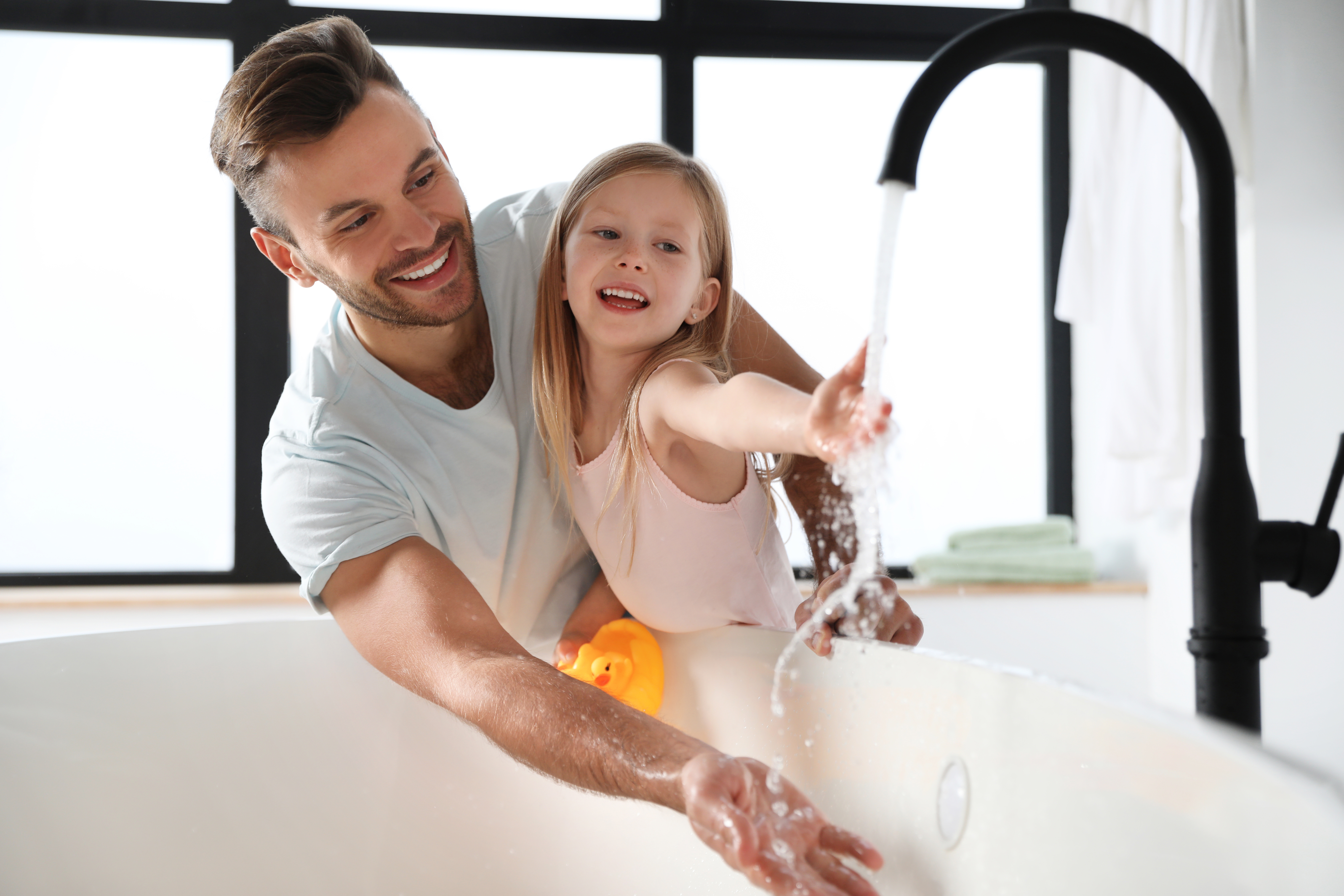 Father and daughter enjoying clean, safe water